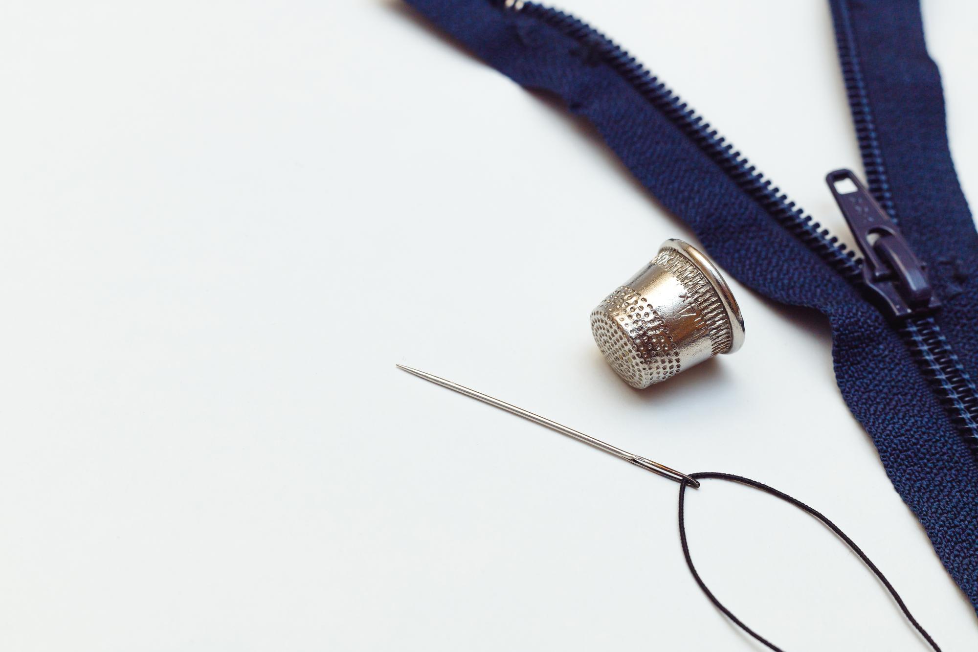 Large editorial shot: embroidered jacket lapel in studio light